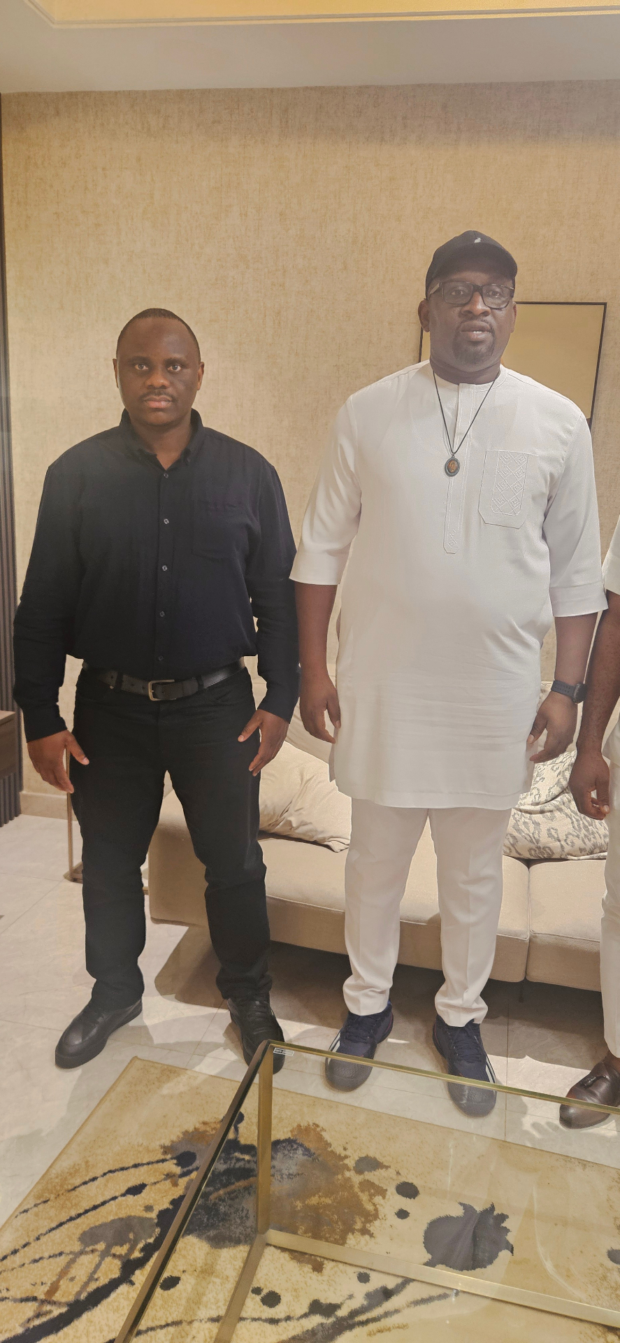 Dr Domor Mienye standing with the APGA National Chairman